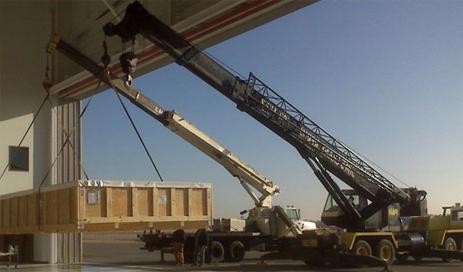 cranes lifting crate